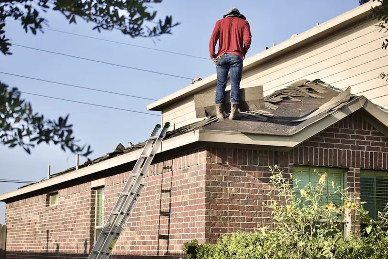 Professional roofer working on a residential roof in Lockhill Estates